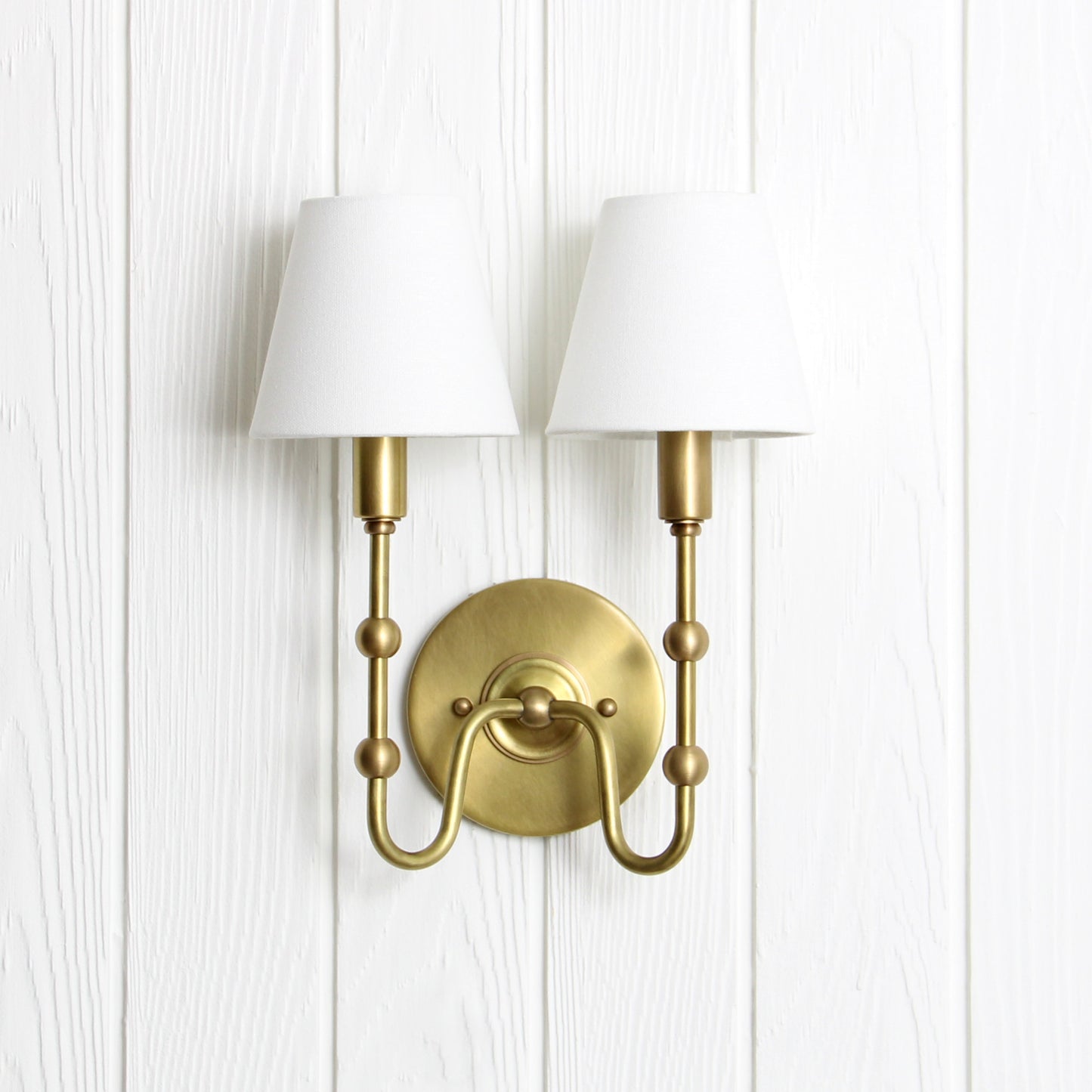 Oyère Dual Wall Sconce in Heritage Brass