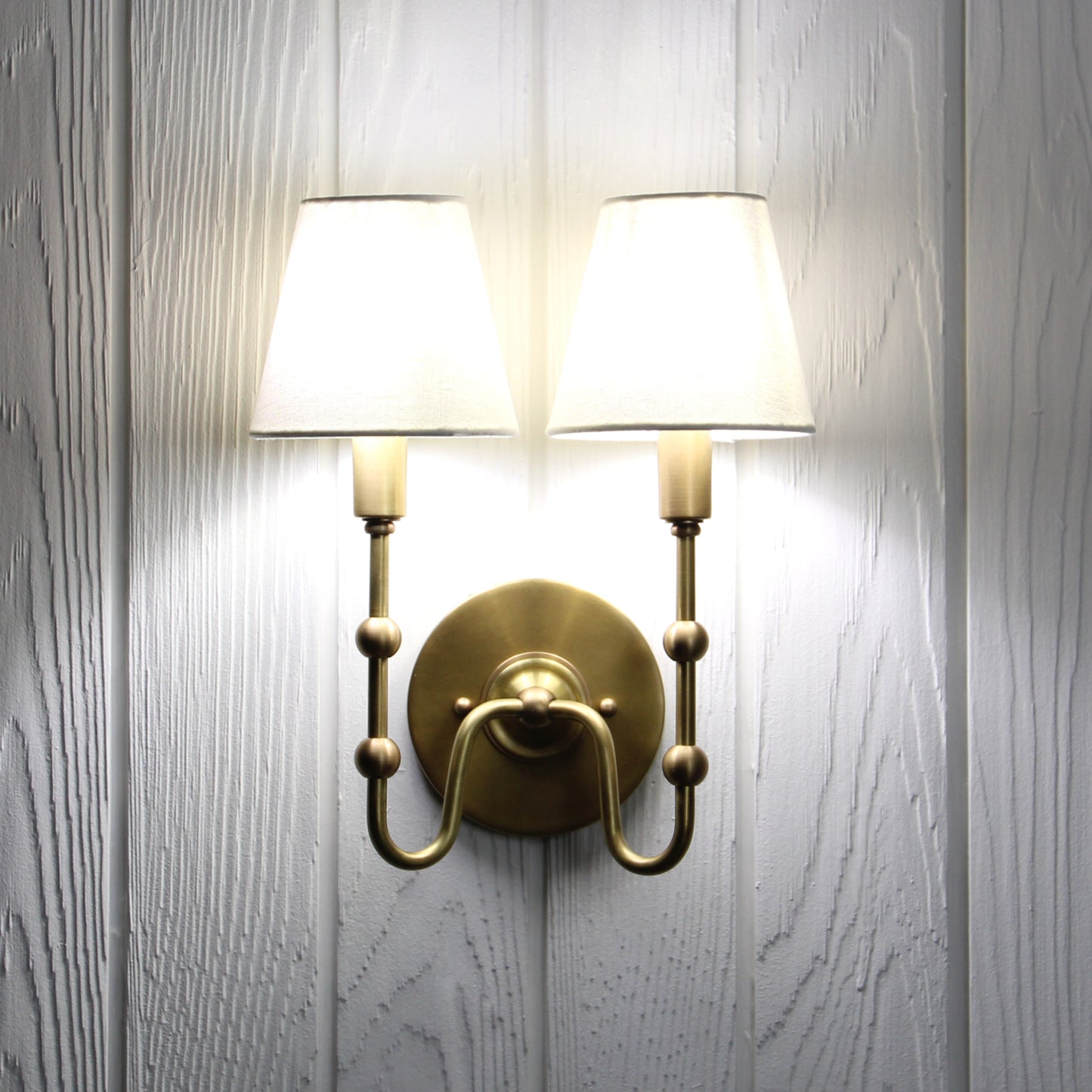 Oyère Dual Wall Sconce in Heritage Brass