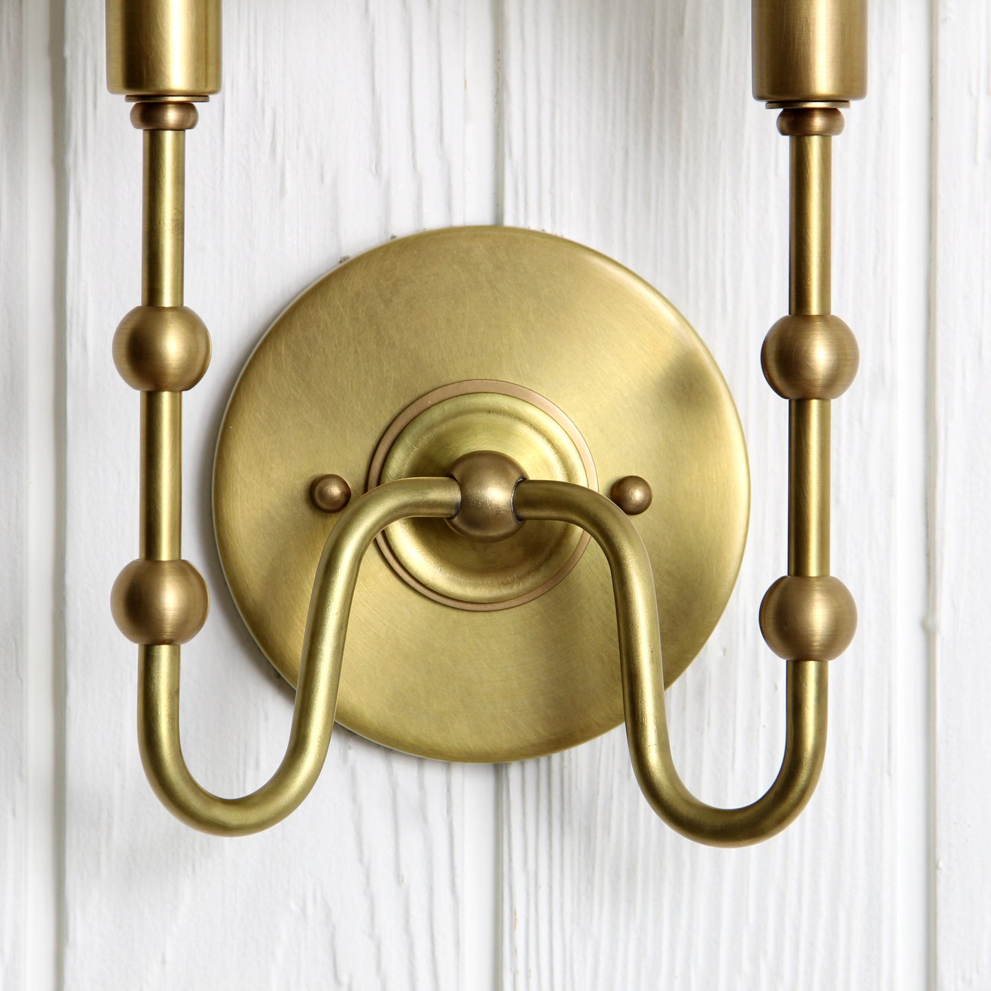 Oyère Dual Wall Sconce in Heritage Brass