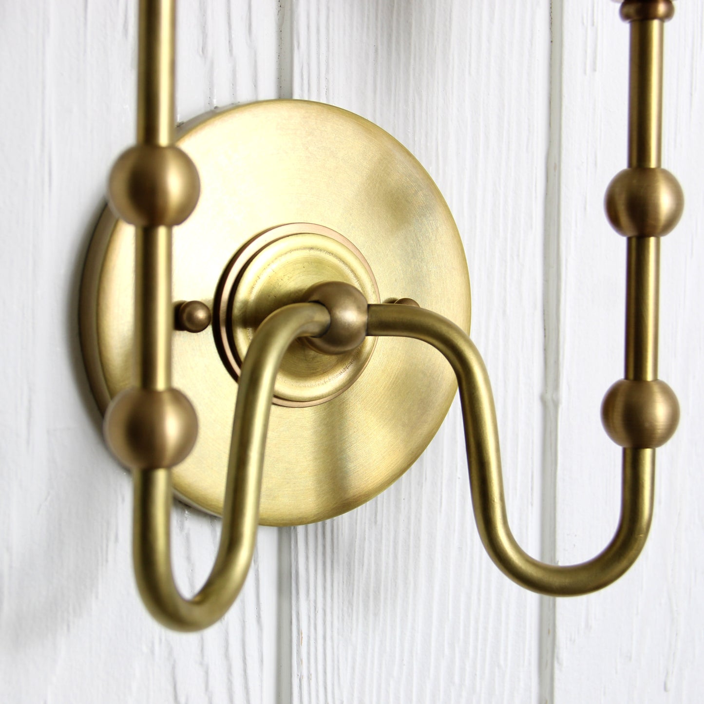 Oyère Dual Wall Sconce in Heritage Brass