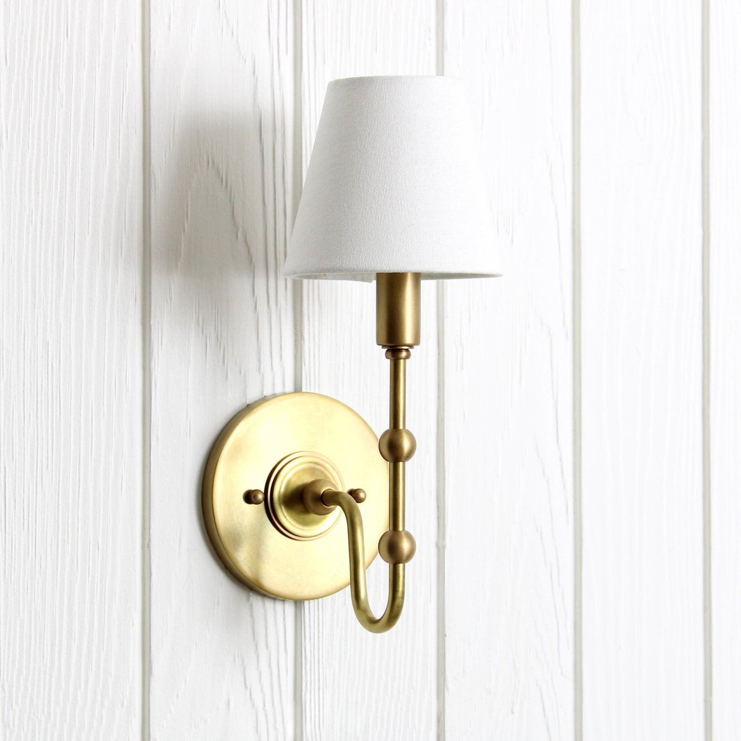Oyère Wall Sconce in Heritage Brass