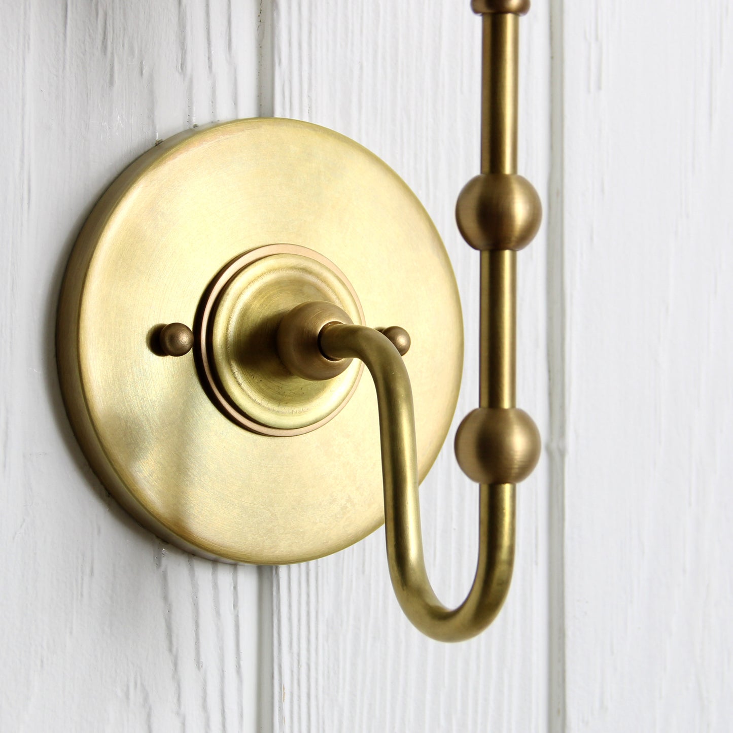 Oyère Wall Sconce in Heritage Brass