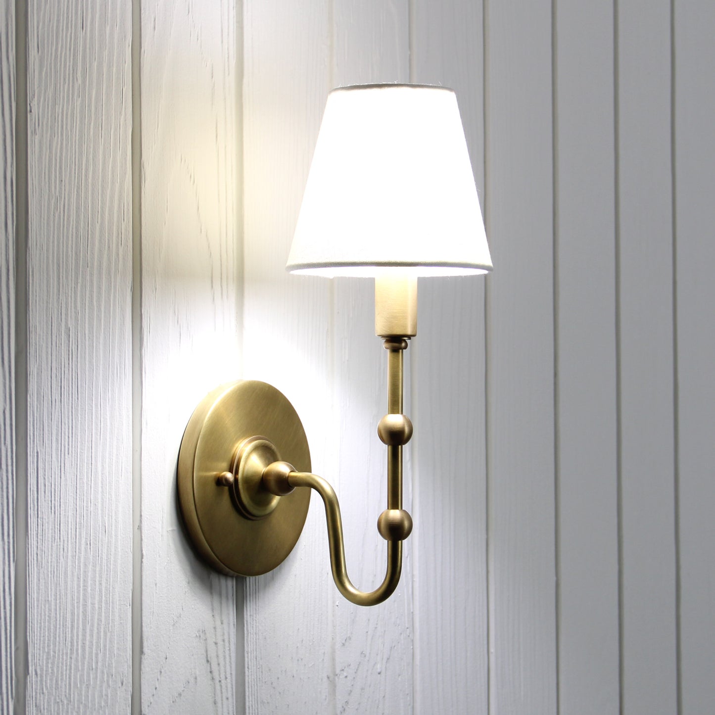 Oyère Wall Sconce in Heritage Brass