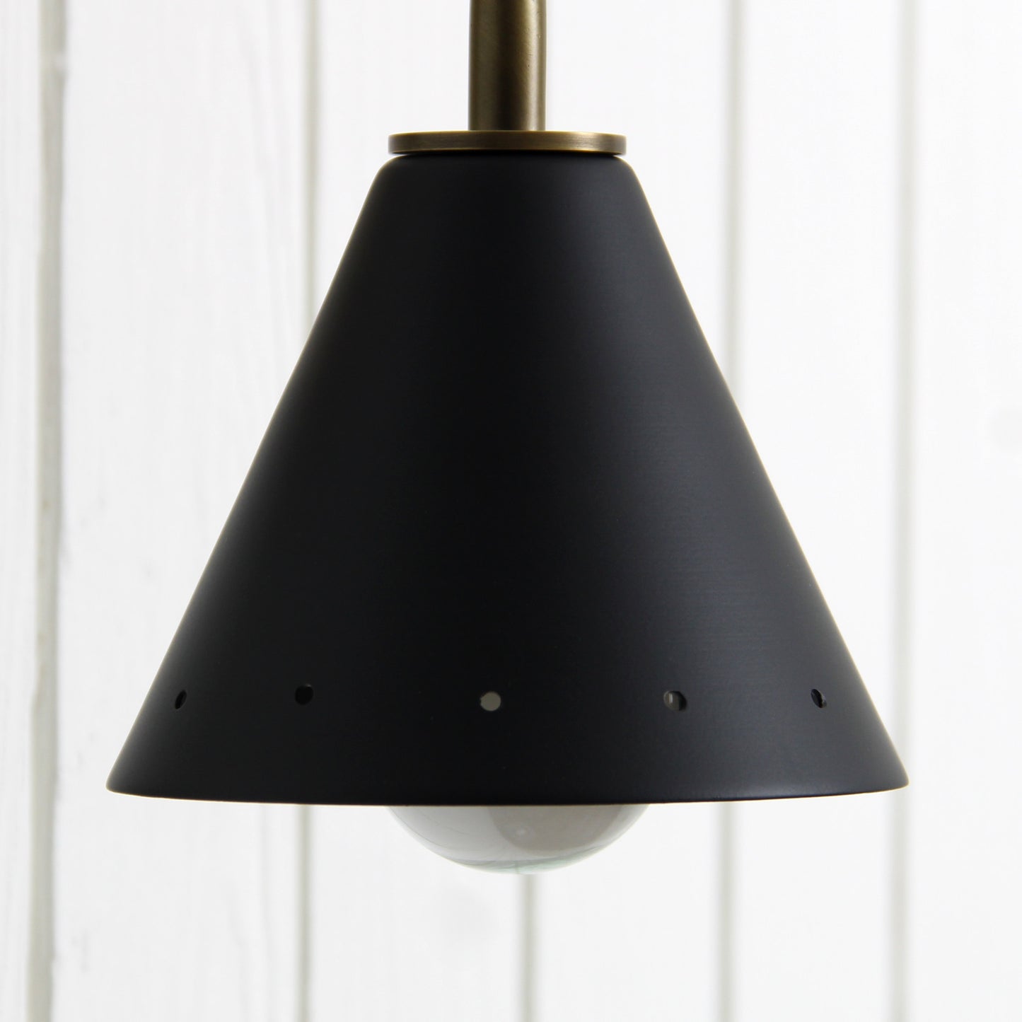 Station Wall Sconce in Aged Satin Brass and Matte Black Perforated