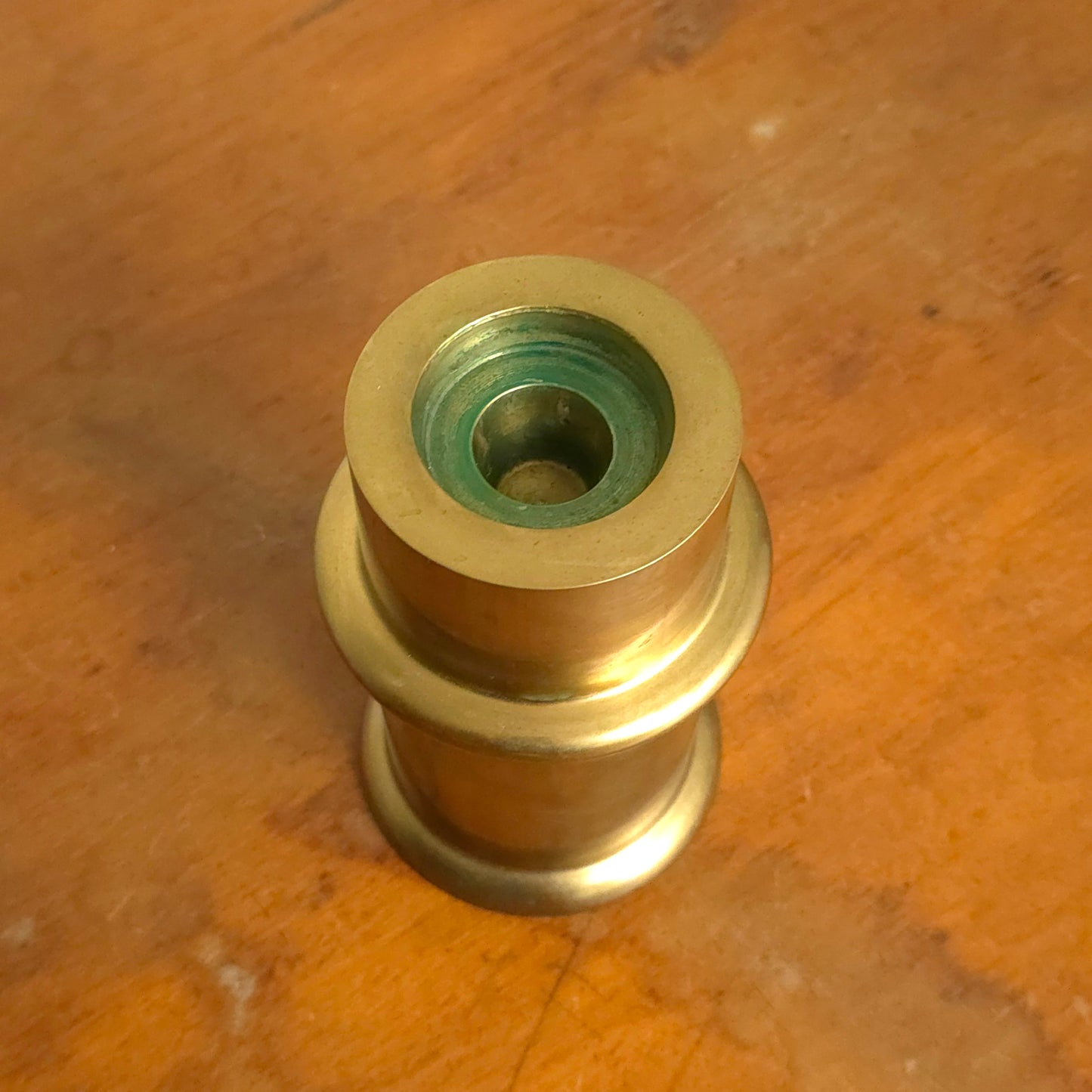 Stout brass segmented cylinder candleholder detail