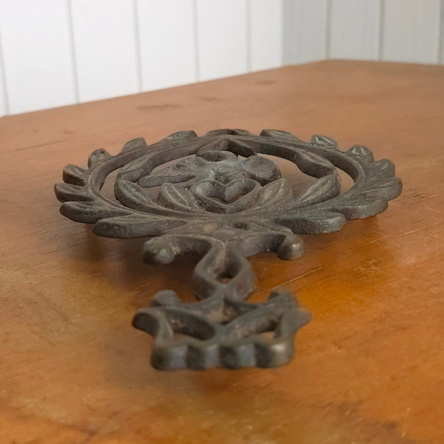 Angled view of Cast Iron Americana Wilton Trivet