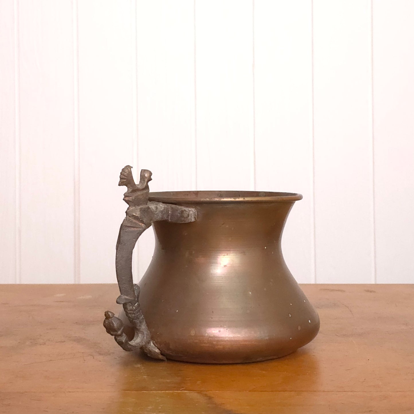 Copper pitcher with brutalist bird handle