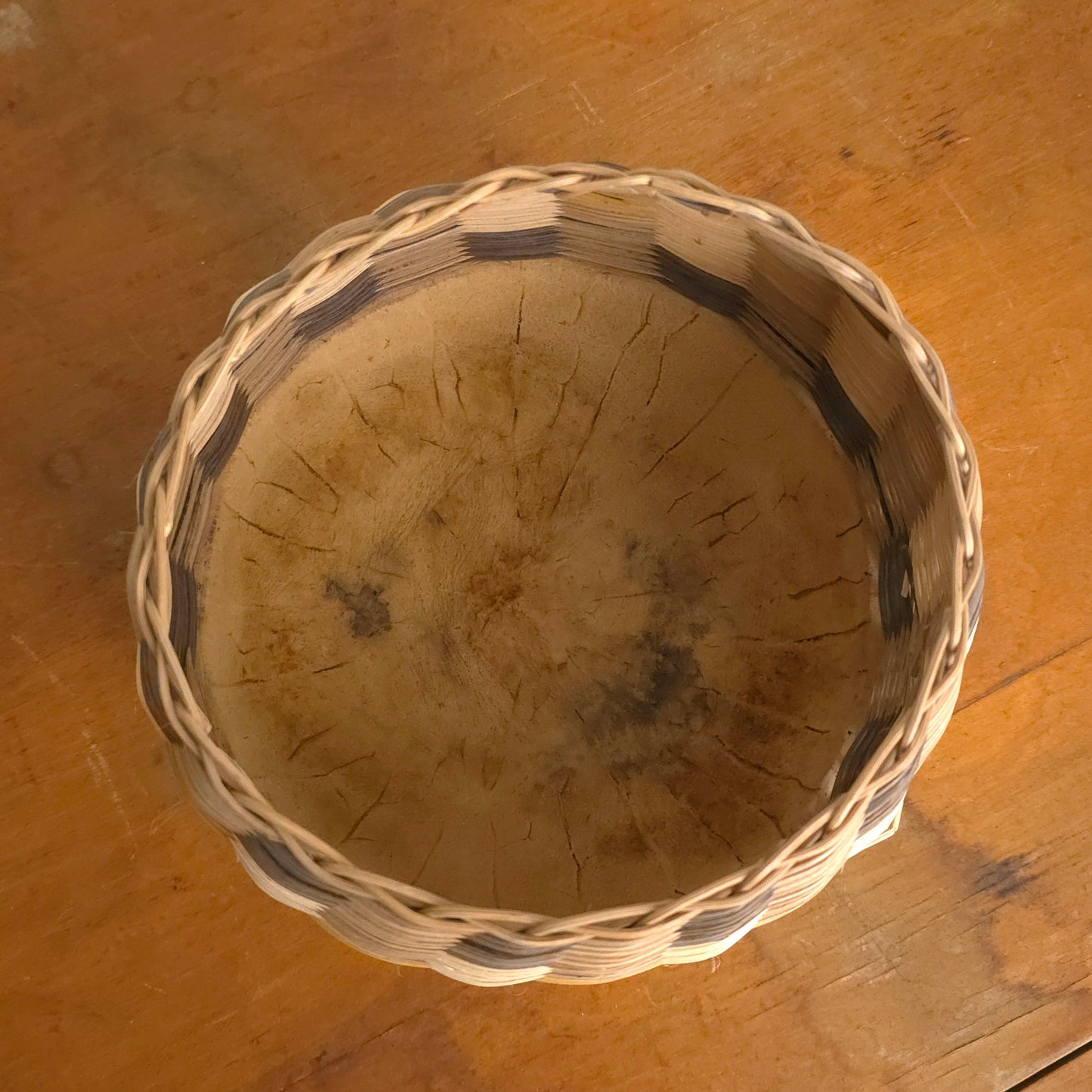 Interior of round gourd-bottom striped basket