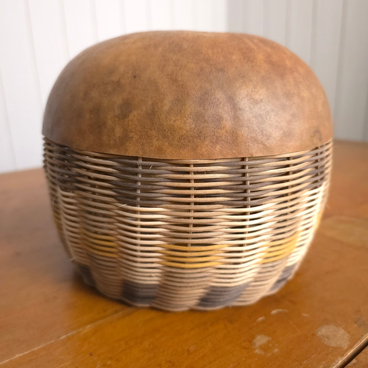 Detail of round gourd-bottom striped basket