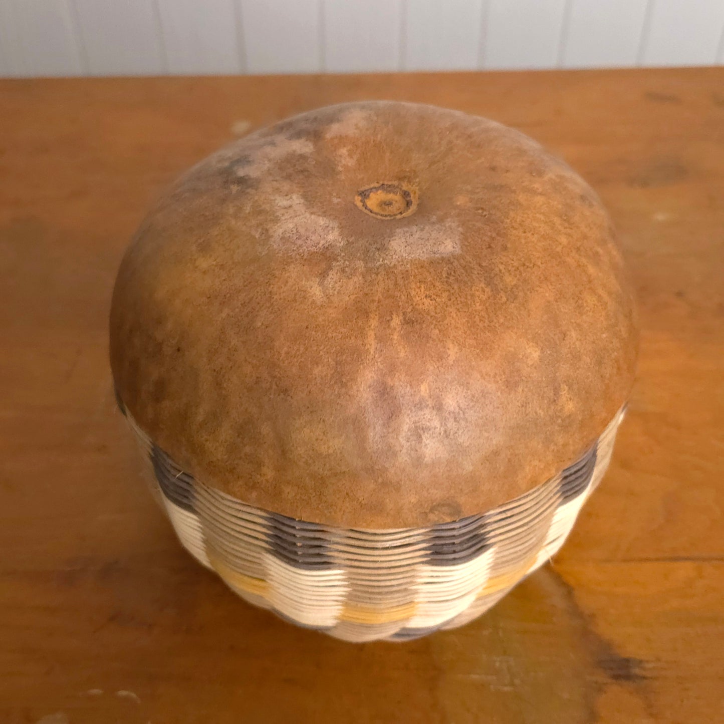 Bottom detail of round gourd-bottom striped basket