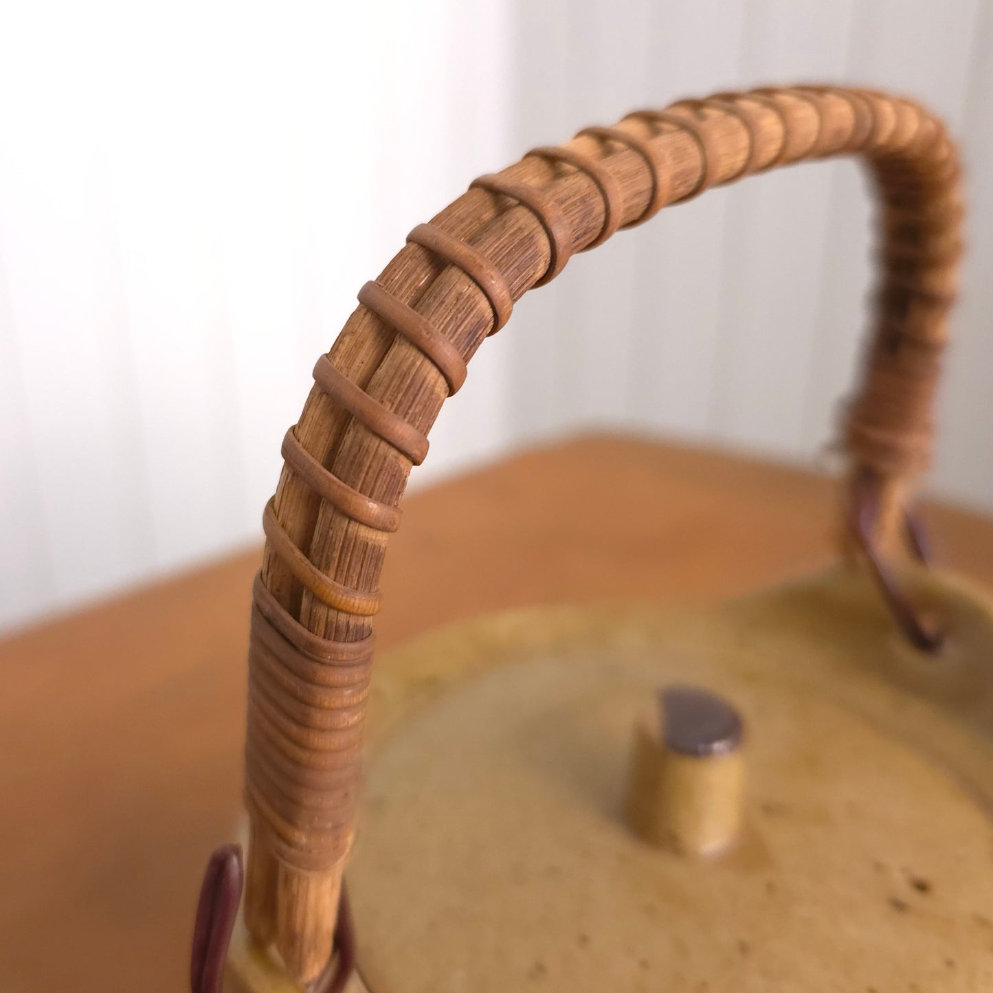 Handle detail of vintage Japanese reed handle earthenware teapot