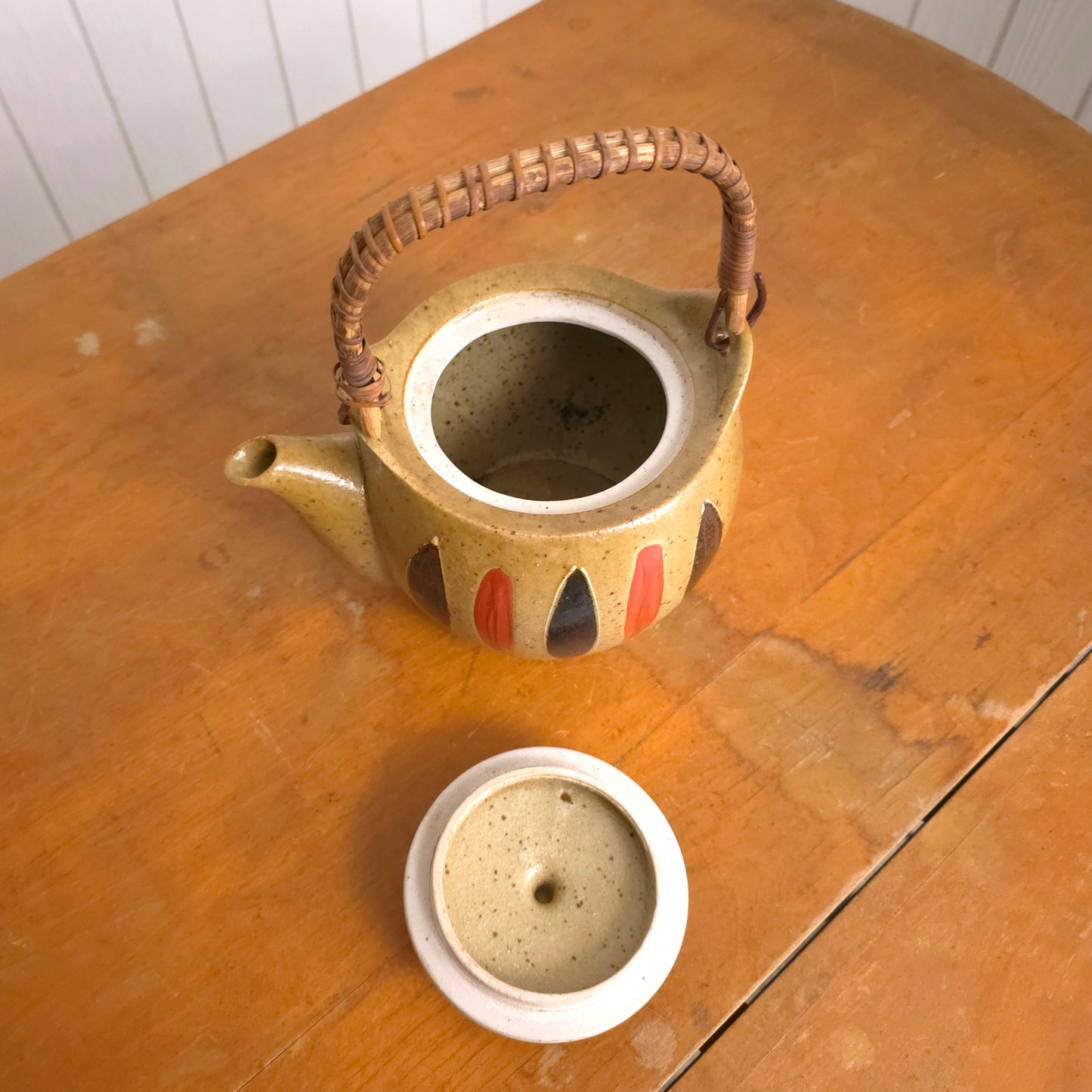Interior of vintage Japanese reed handle earthenware teapot