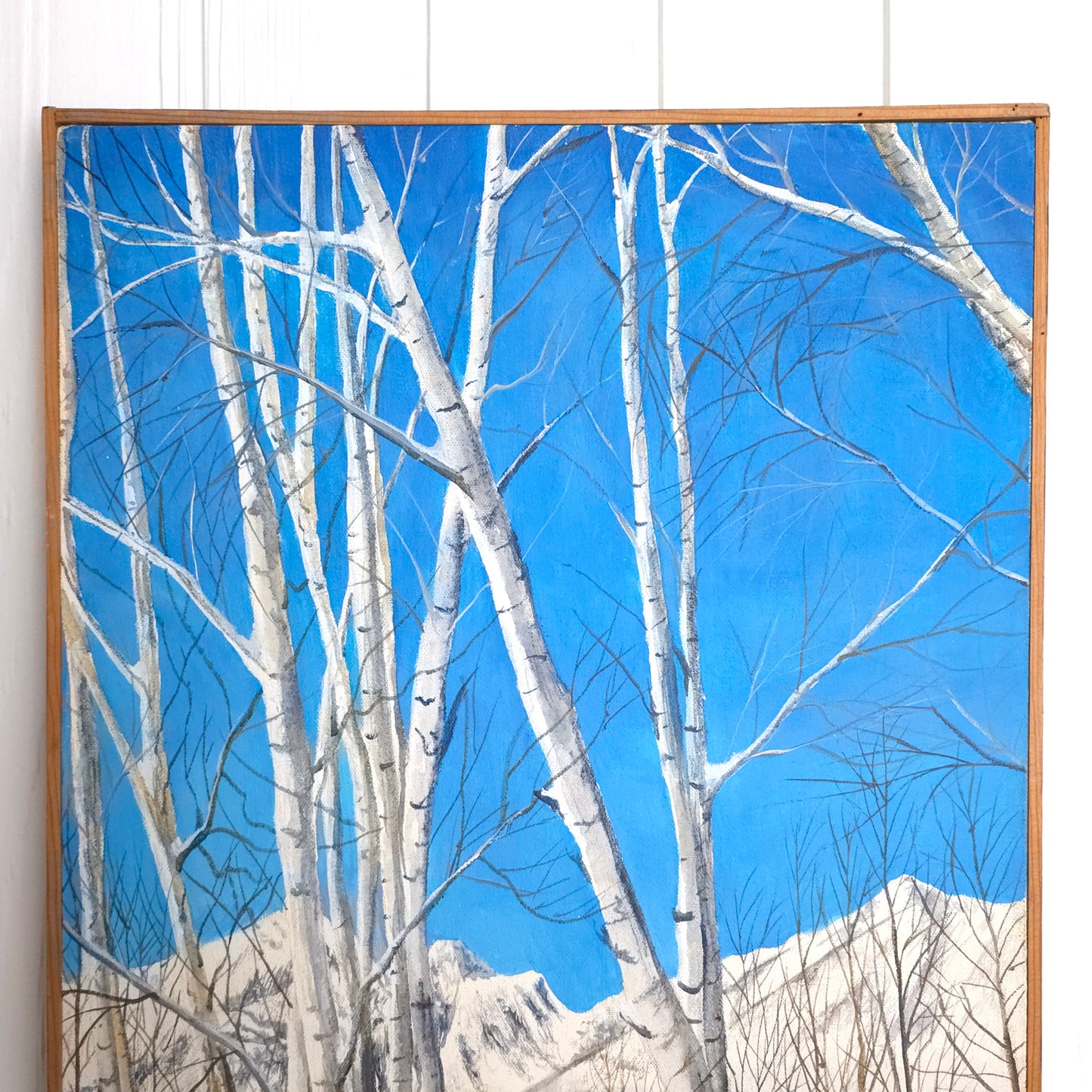Detail of vintage vibrant blue birch tree landscape painting