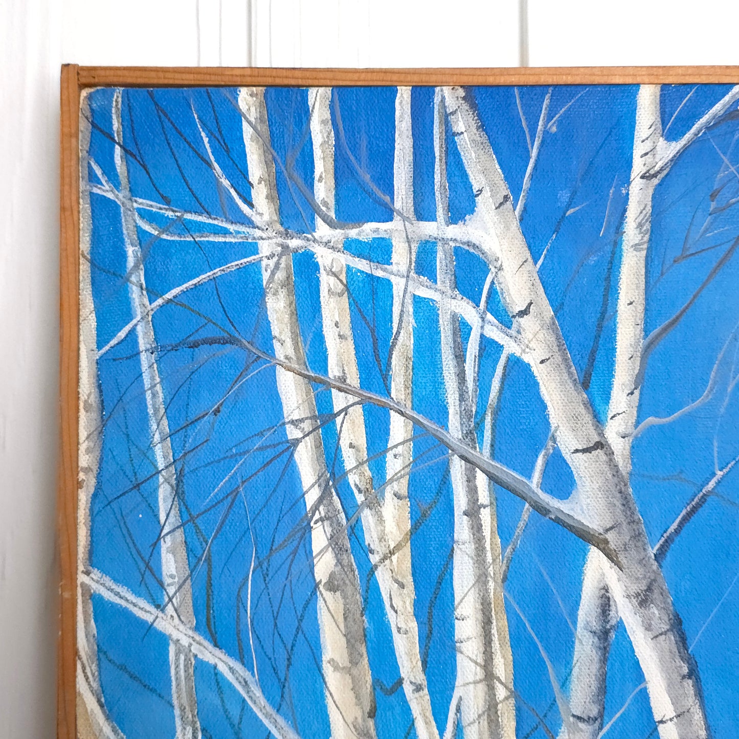 Detail of vintage vibrant blue birch tree landscape painting