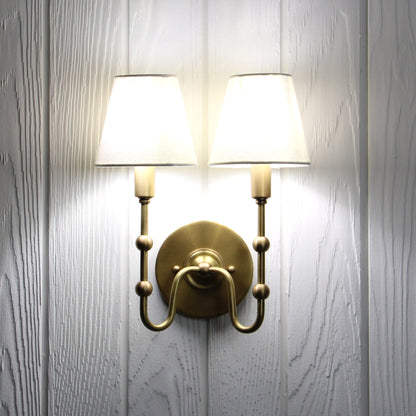 Oyère Dual Wall Sconce in Heritage Brass