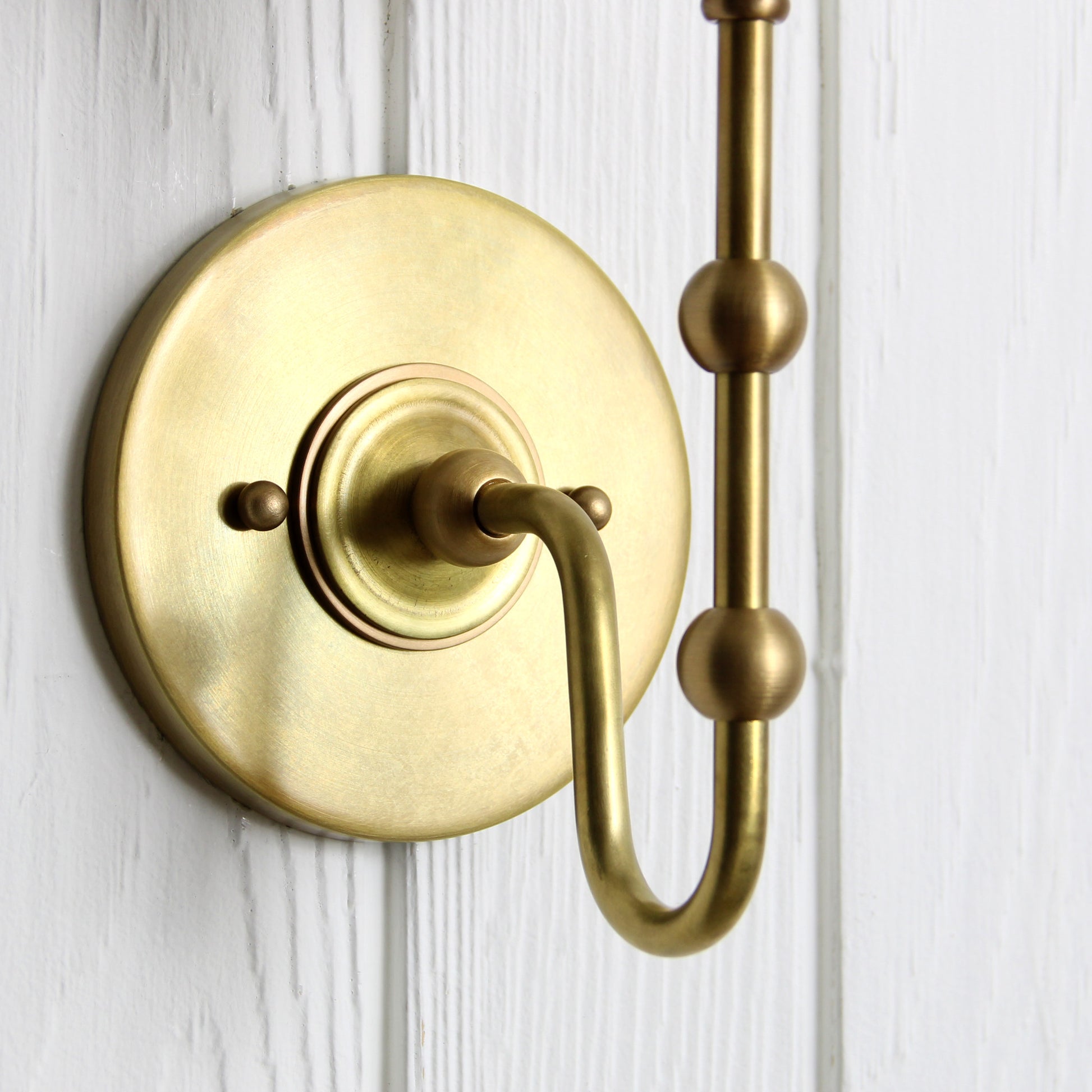 Oyère Wall Sconce in Heritage Brass