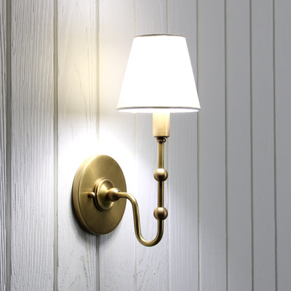 Oyère Wall Sconce in Heritage Brass