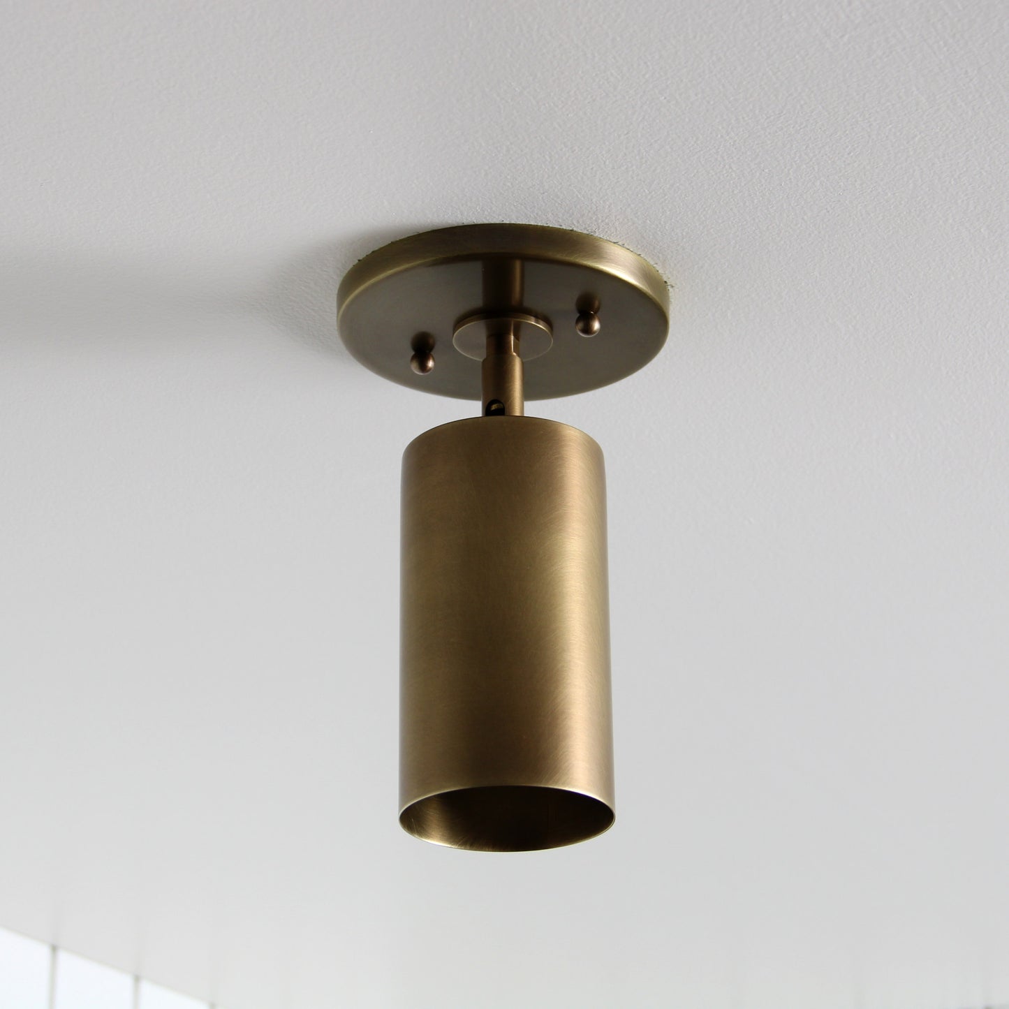 Post Flush Mount Swivel in Aged Brass