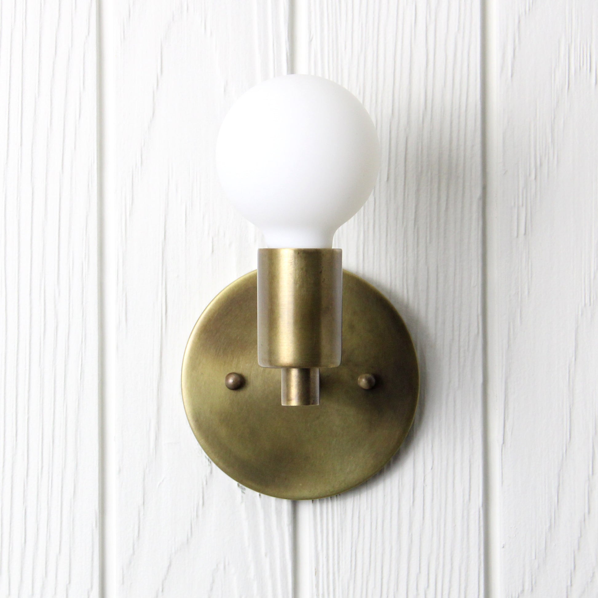 Trek Notch Wall Sconce in Patina Brass