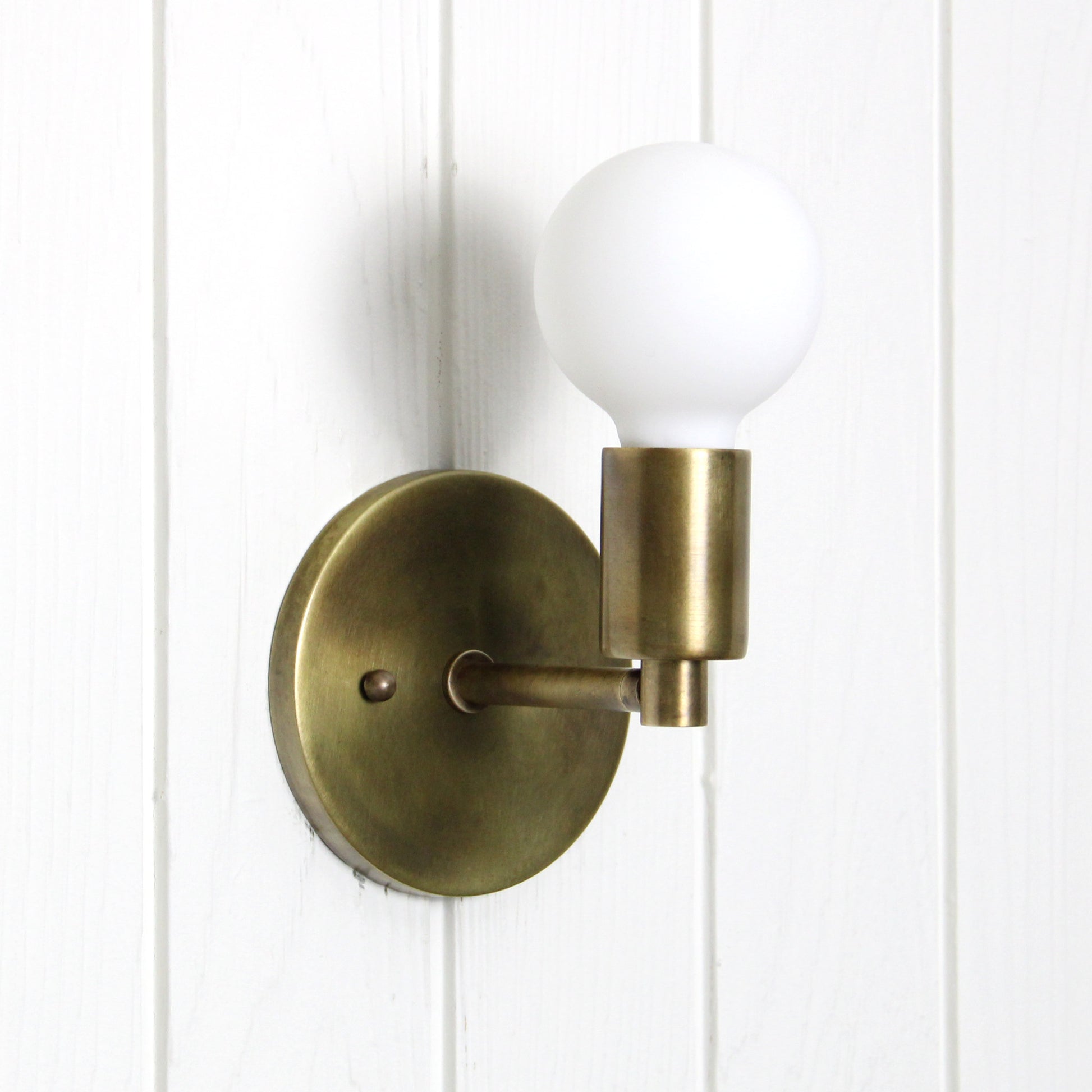 Trek Notch Wall Sconce in Patina Brass