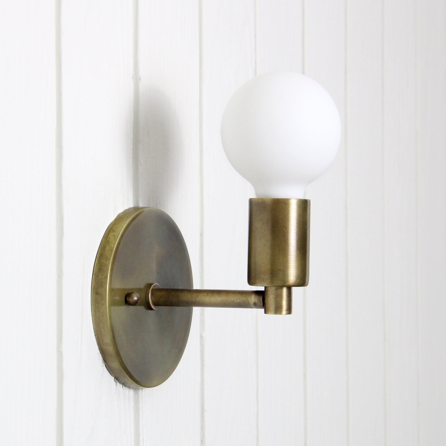 Trek Notch Wall Sconce in Patina Brass