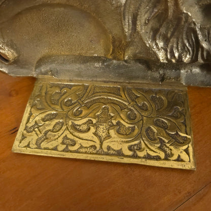 Base detail of Vintage Cast Brass Lion Bookends