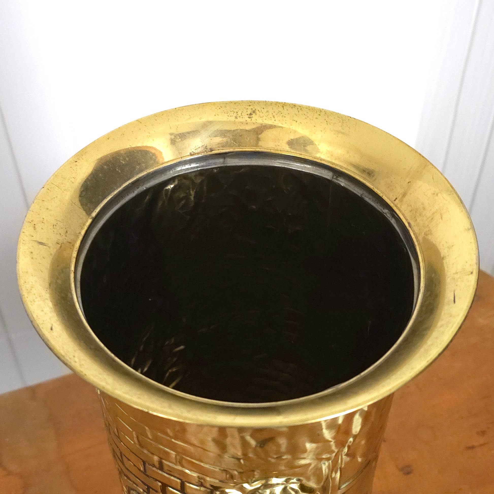 Top detail of Vintage English Brass Embossed Relief Umbrella Cane Stand