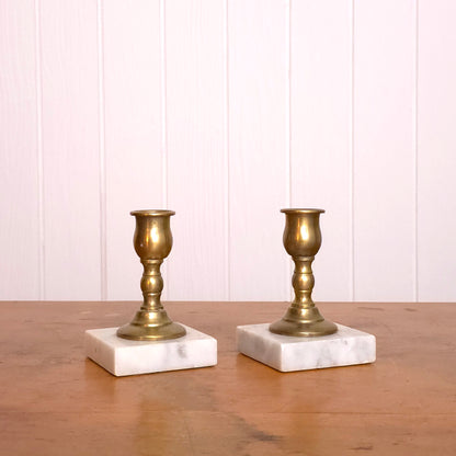 Pair of solid brass candleholders with marble bases