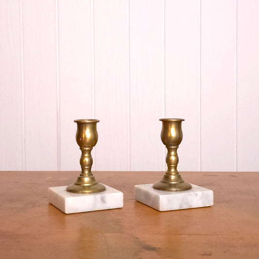 Pair of solid brass candleholders with marble bases
