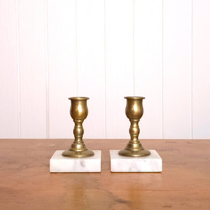 Pair of solid brass candleholders with marble bases