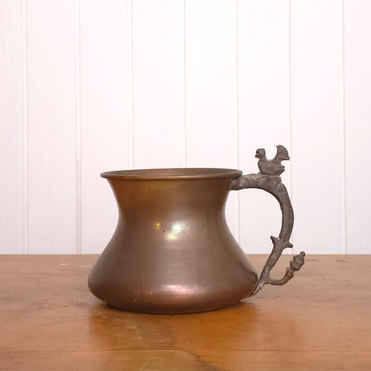 Copper pitcher with brutalist bird handle