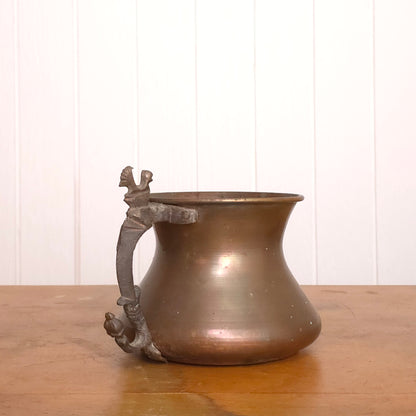 Copper pitcher with brutalist bird handle