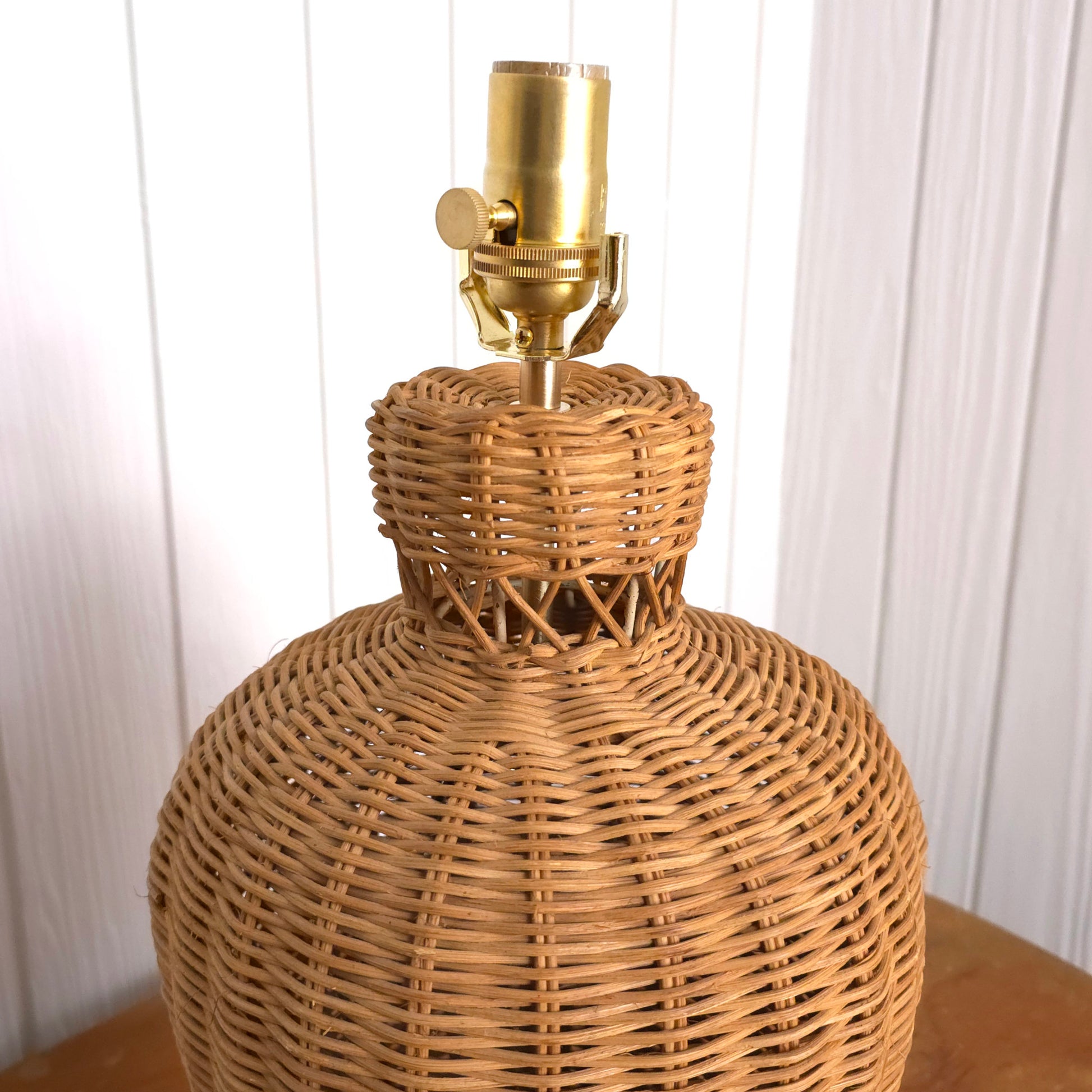Detail of Vintage Lattice Neck Wicker Basket and Brass Table Lamp