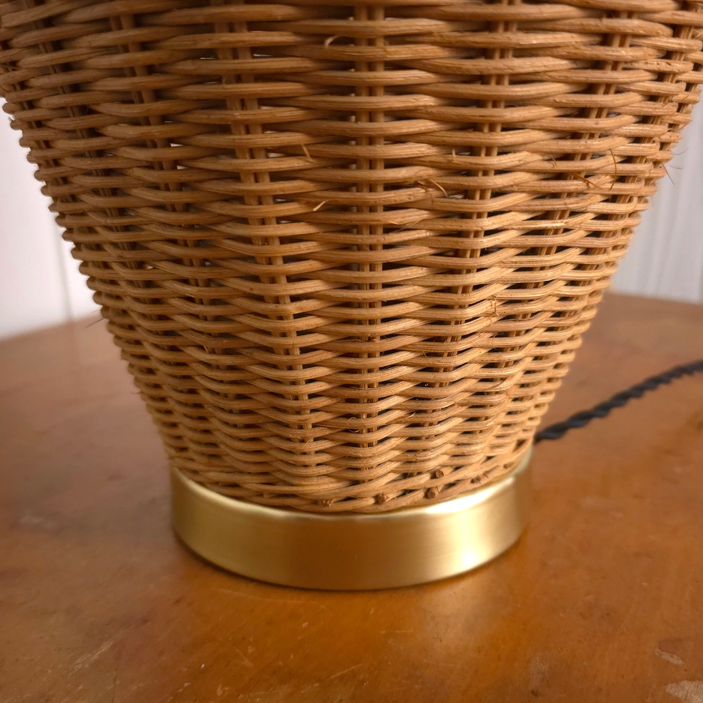 Base detail of Vintage Lattice Neck Wicker Basket and Brass Table Lamp