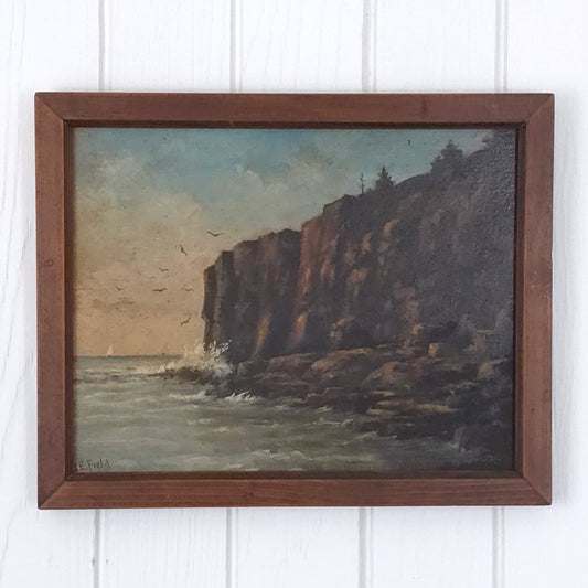 Vintage seaside cliff painting by J.E. Field