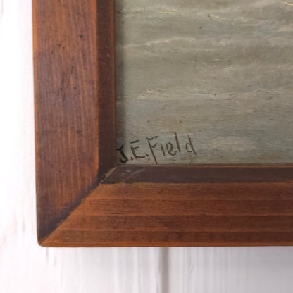 Signature of vintage seaside cliff painting by J.E. Field