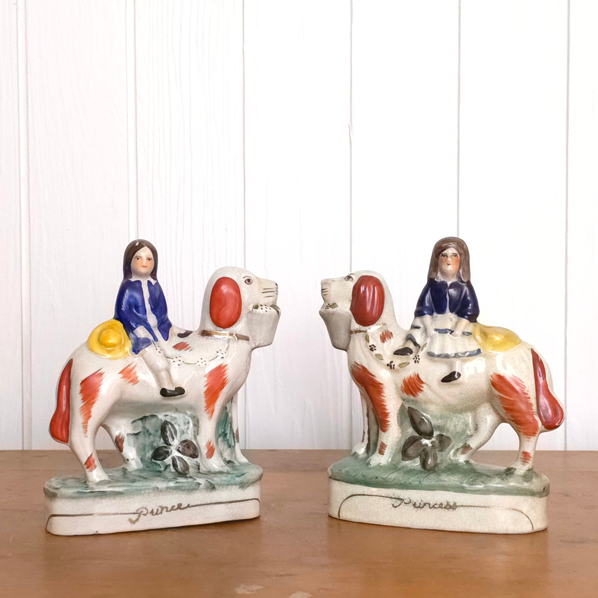 Staffordshire Porcelain Prince and Princess Dog Statues