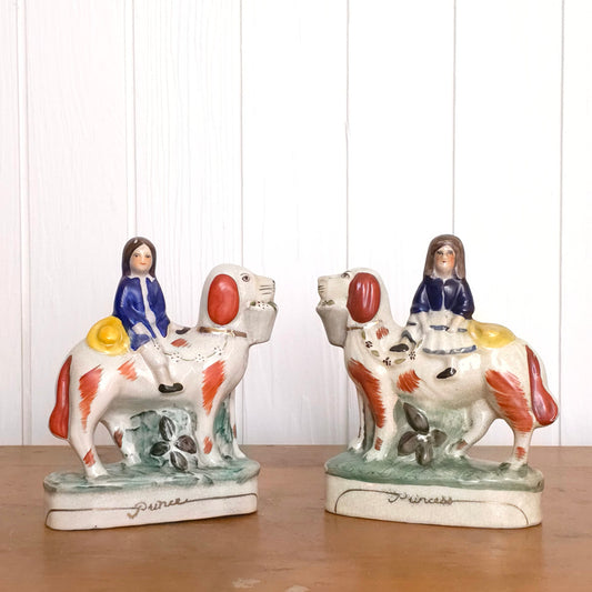 Staffordshire Porcelain Prince and Princess Dog Statues