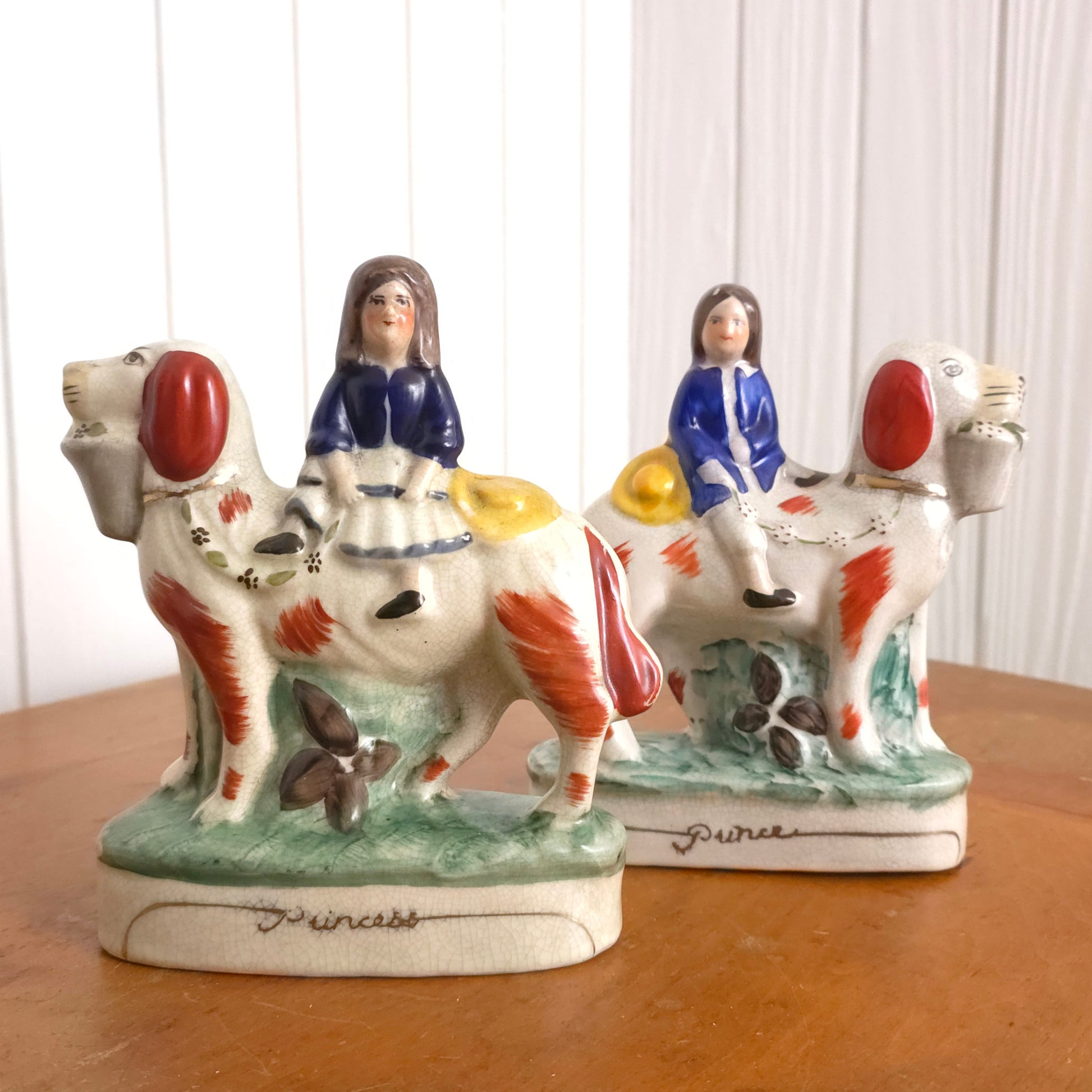 Staffordshire Porcelain Prince and Princess Dog Statues