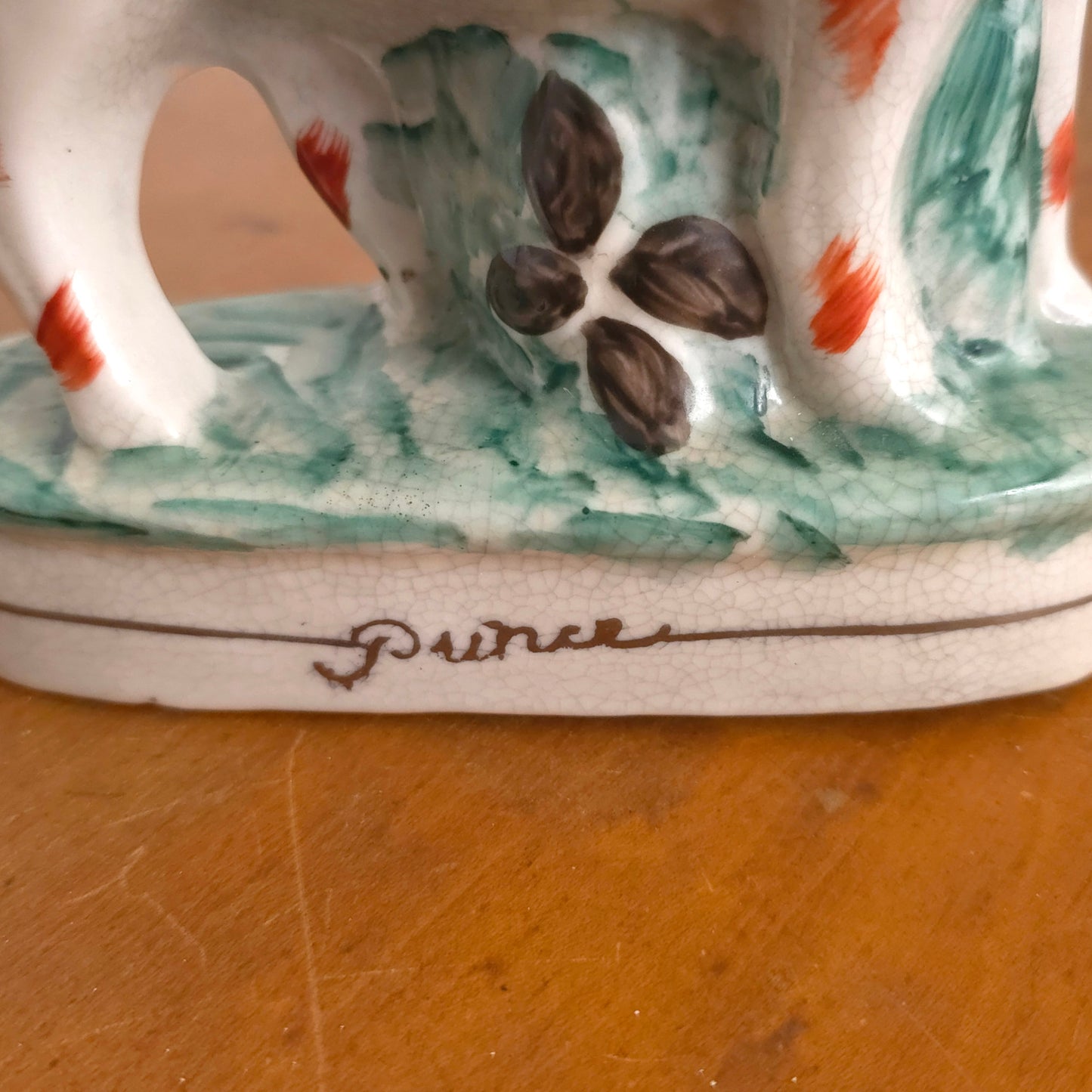 Prince detail of Staffordshire Porcelain Prince and Princess Dog Statues