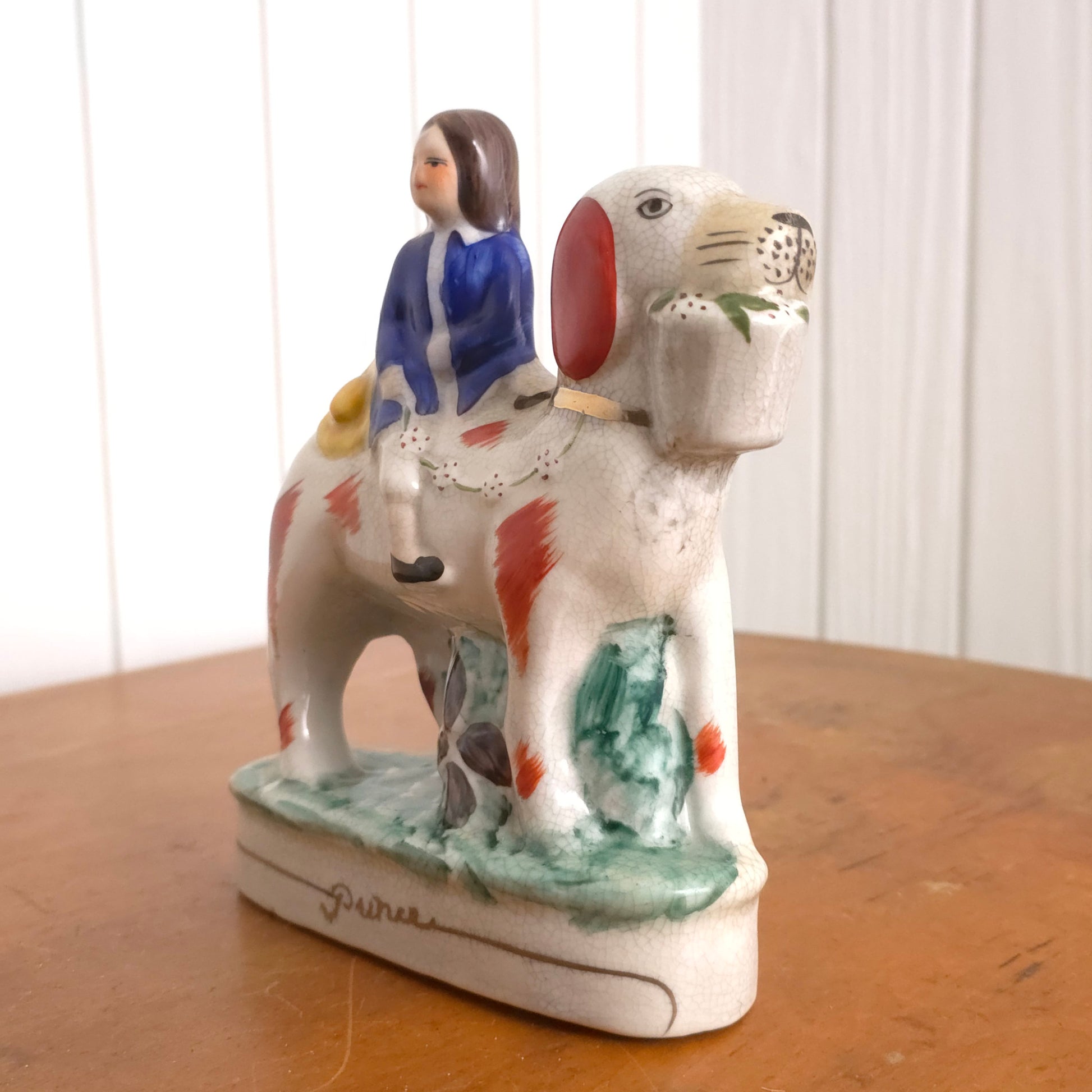 Prince detail of Staffordshire Porcelain Prince and Princess Dog Statues