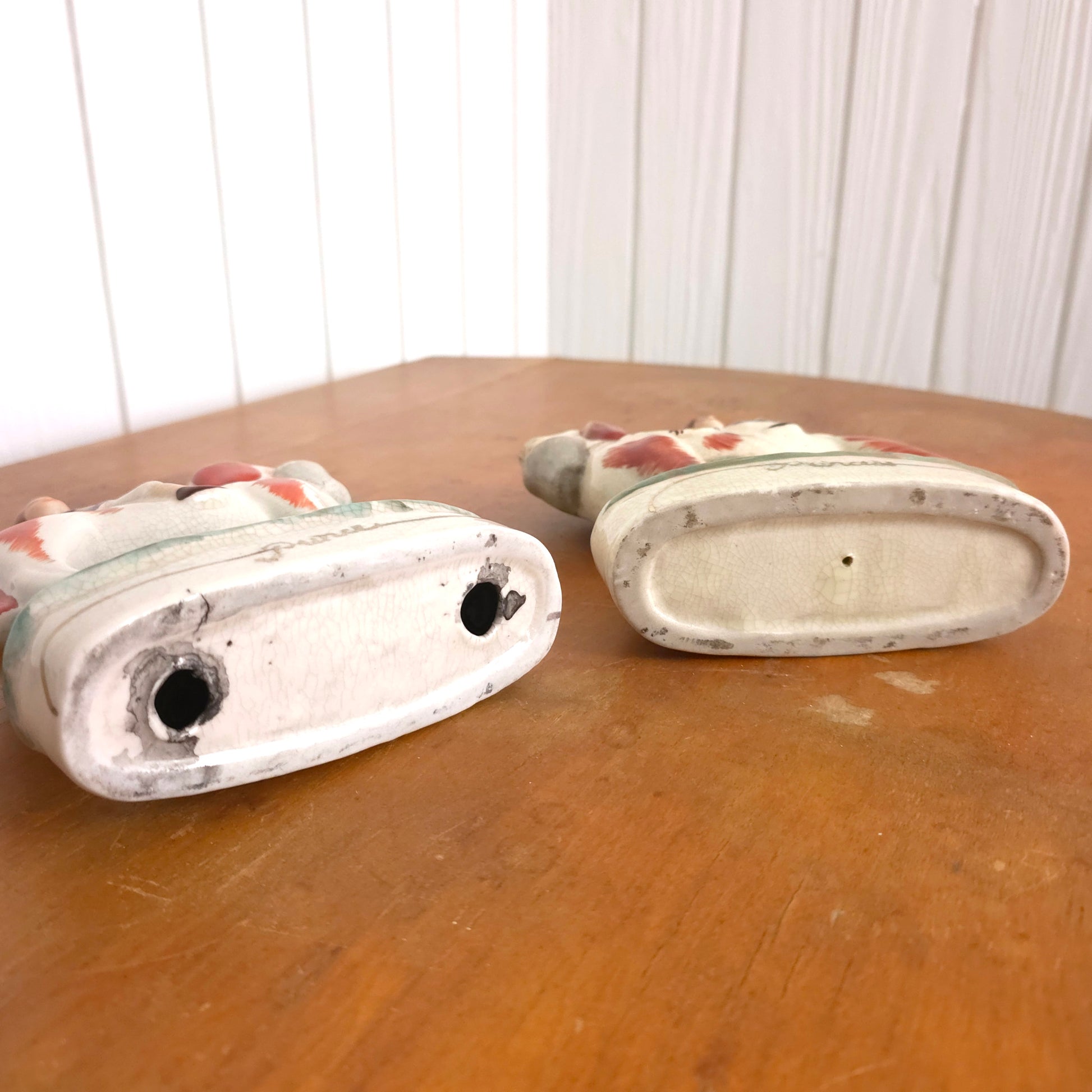 Bottom detail of Staffordshire Porcelain Prince and Princess Dog Statues